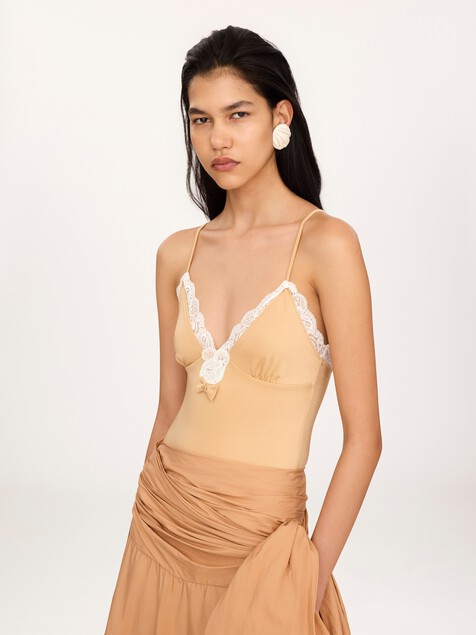Lace-trimmed ruched bodysuit