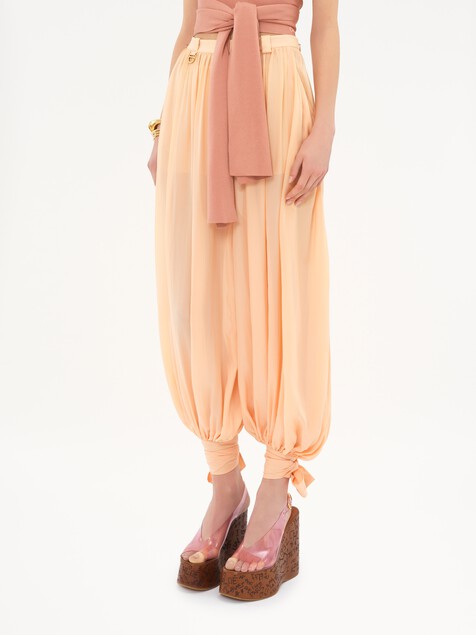 Fluid pleated trousers in silk charmeuse