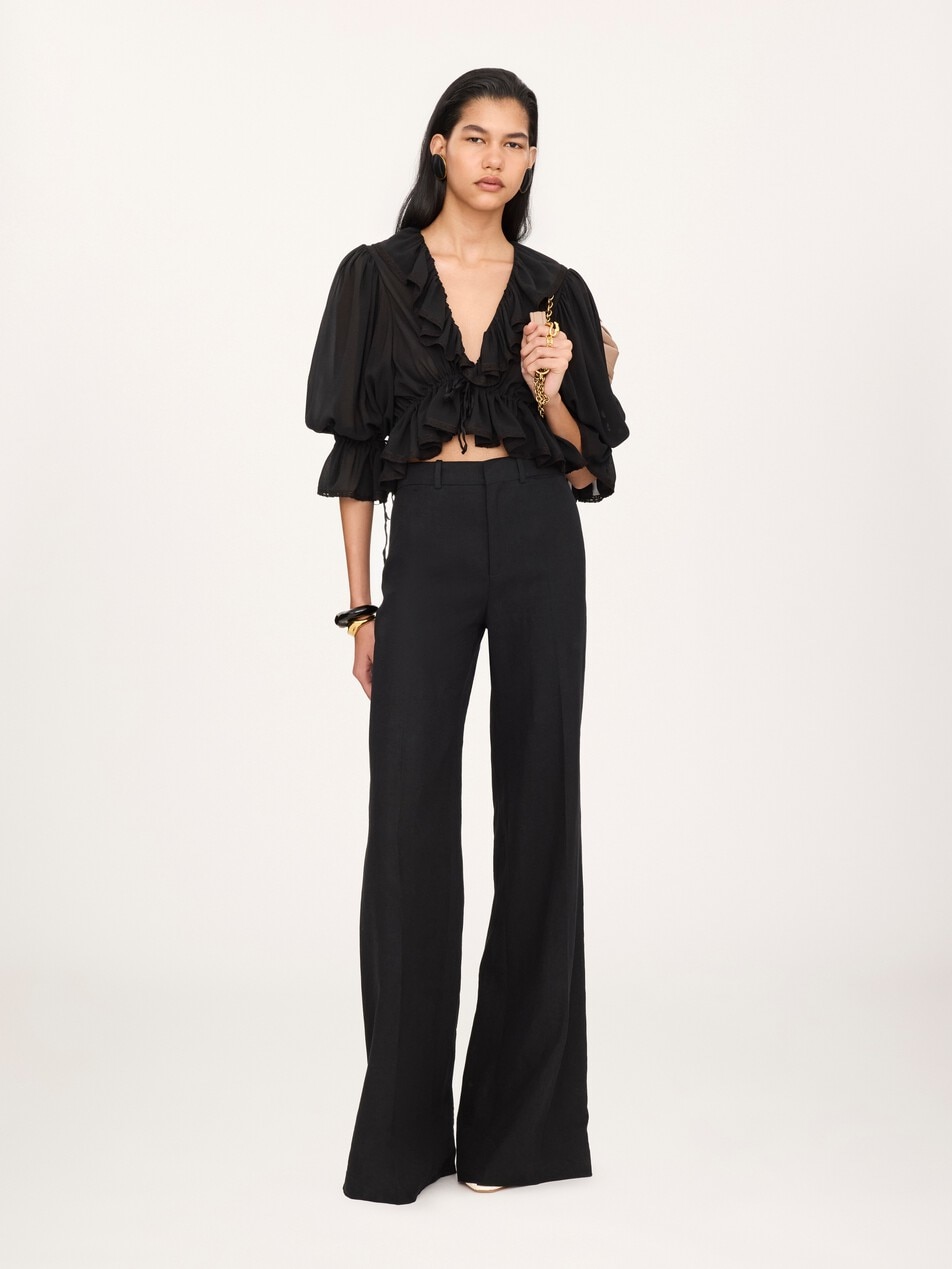 Flared high-rise trousers in linen cr&ecirc;pe