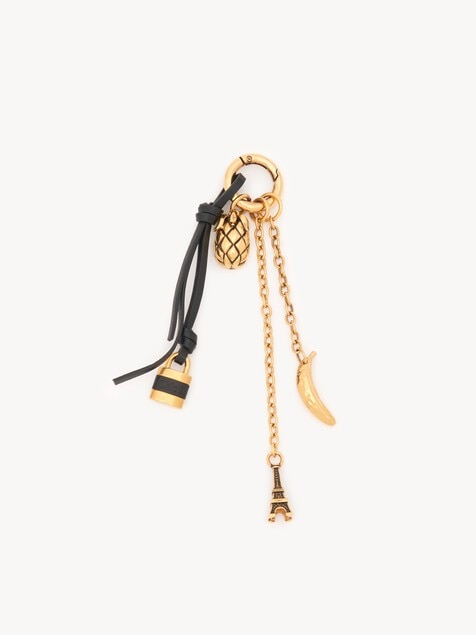 Charm para bolso en miniatura de lat&oacute;n y cuero