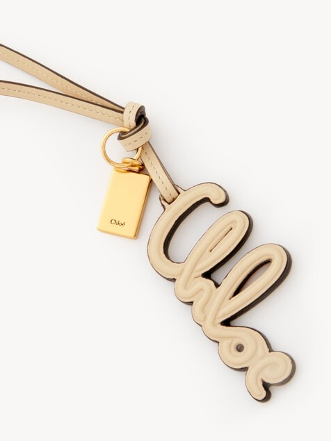Charm para bolso con logotipo de cuero brillante