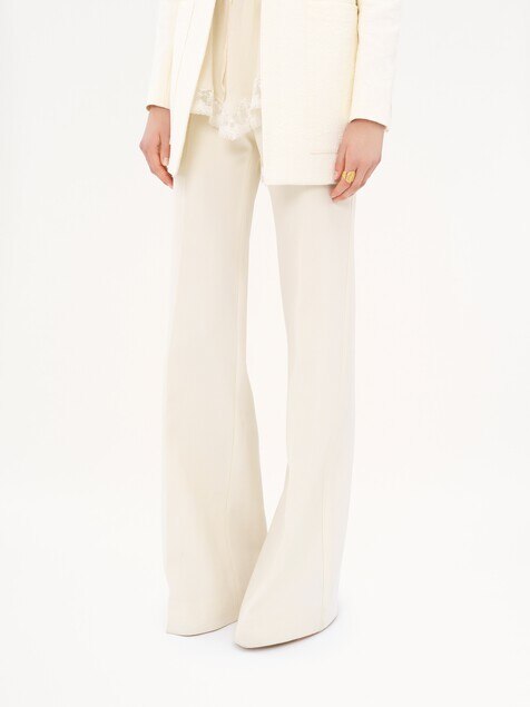 High-rise flared pants in wool grain de poudre