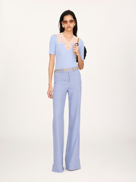 Flared high-rise trousers in linen cr&ecirc;pe