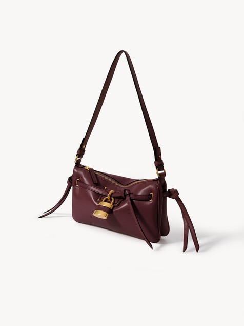 Minibolso pouch Paddington Sling con correa de cuero suave
