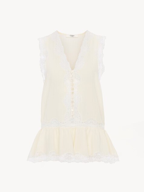Sleeveless peplum top in cr&ecirc;pe de chine & lace