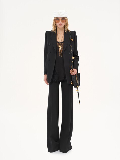 High-rise flared pants in wool grain de poudre